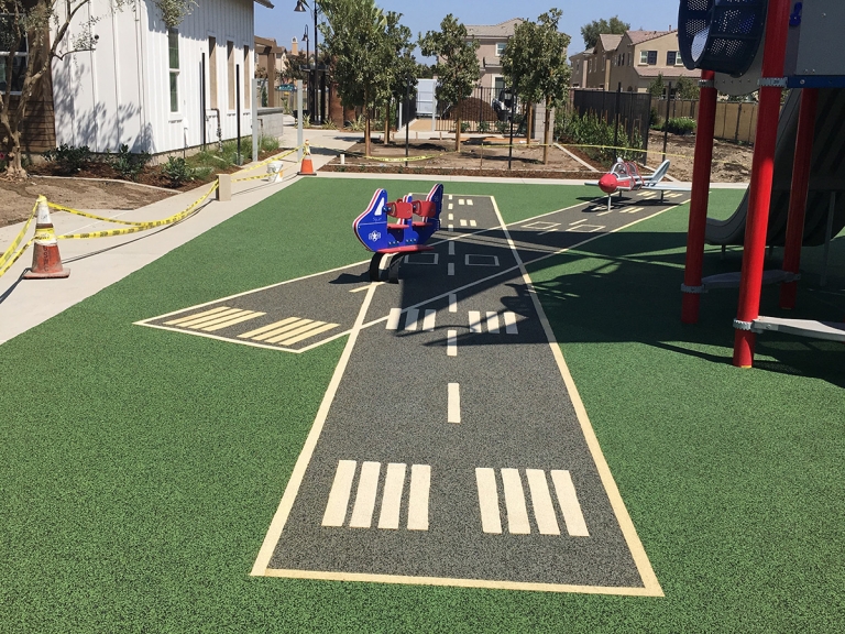 spectrapour rubber installation on at the landings park in chino, ca