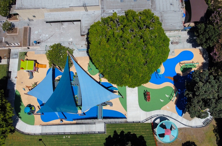 blue playground safety surface at marine park, santa monica