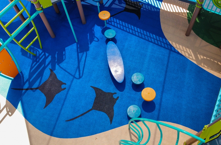 blue playground safety surface at marine park, santa monica