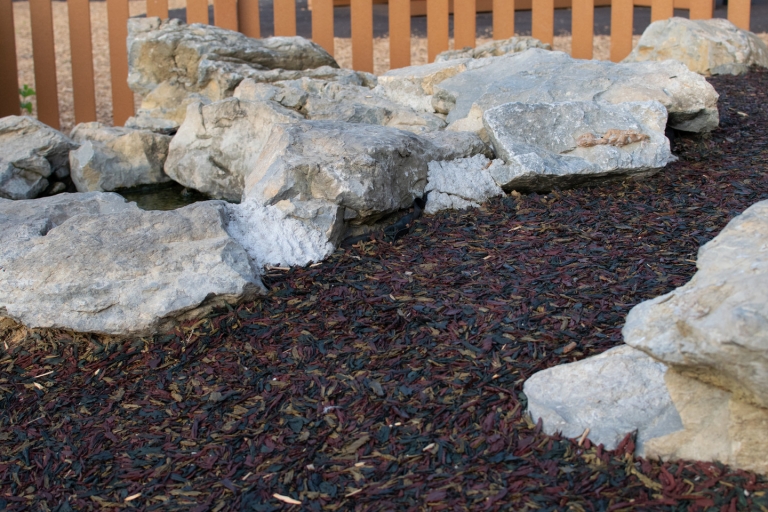 bonded rubber mulch mat around stones