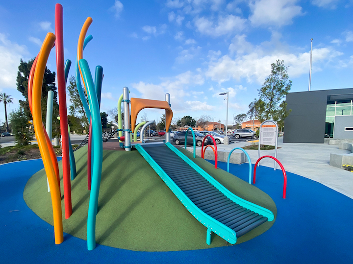 greater whittier regional aquatic center playground area with artificial turf