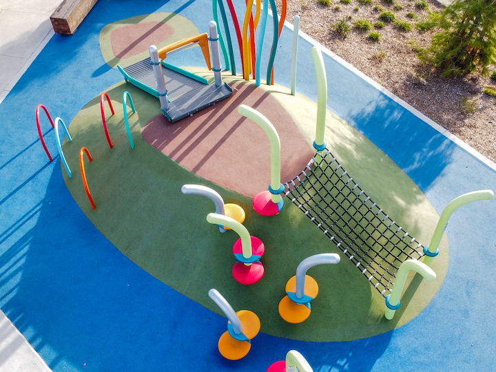 greater whittier regional aquatic center playground area with artificial turf