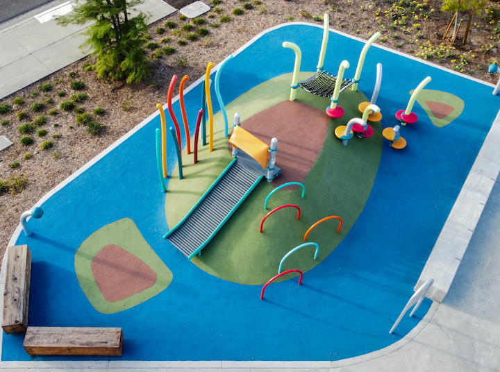 The greater whittier regional aquatic center playground area with artificial turf