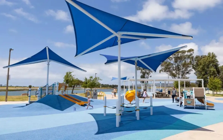 blue shade sails over play areas