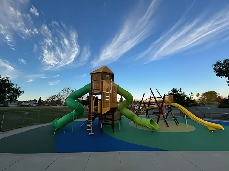 beautiful custom playground on blue and green rubber flooring