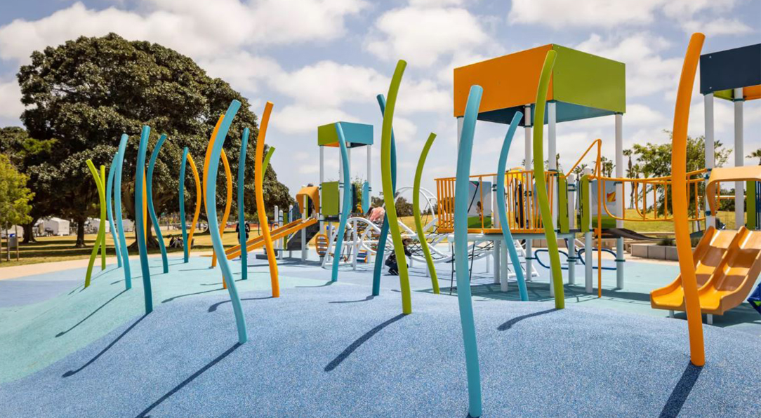 unique playground equipment on blue rubber surface