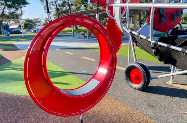 red playground airplane